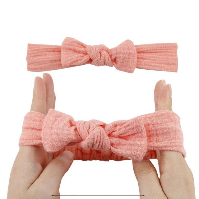 Bentita cu fundita roz pal din material elastic