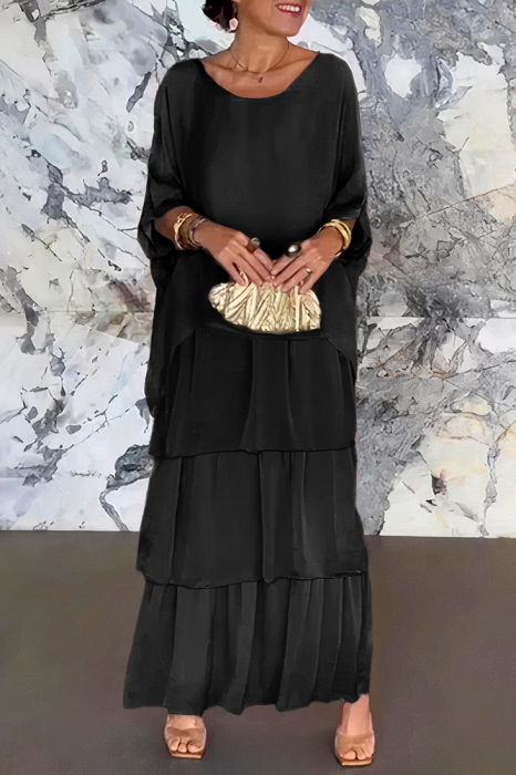 Rochie lunga suprapusa din matase si vascoza, cu trei volane mari si maneca cazuta, neagra