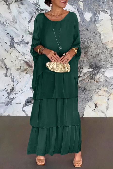 Rochie lunga suprapusa din matase si vascoza, cu trei volane mari si maneca cazuta, verde inchis