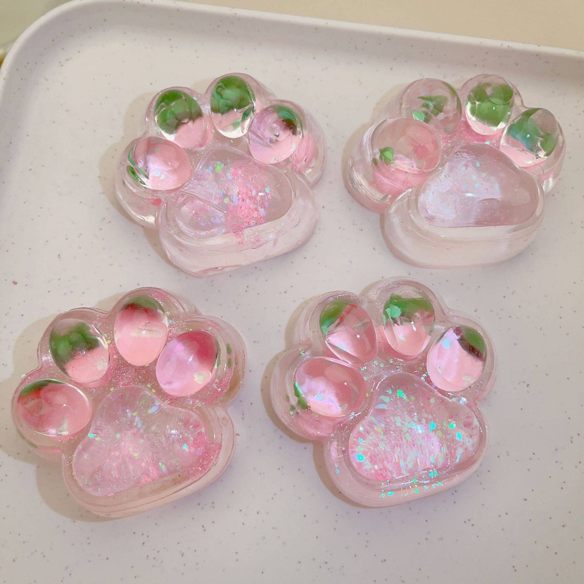 Jucarii Squishy si Gonggi - Jucarie Antistres Squishy, Flippy, cu Revenire Lenta, Squeeze Pinch Family, Model Labuta de Pisica cu Sclipici, 6.5x6 cm, 60g, Ambalaj Transparent, Roz