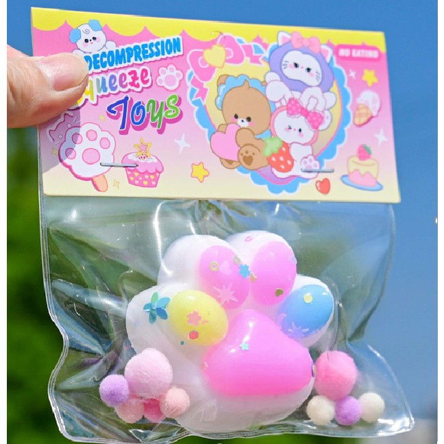 Jucarii Squishy si Gonggi - Jucarie Antistres Squishy, Flippy, cu Revenire Lenta, Labuta de Pisica Pufoasa, 7.5 cm, Ambalaj Transparent, Model 27056, Multicolor