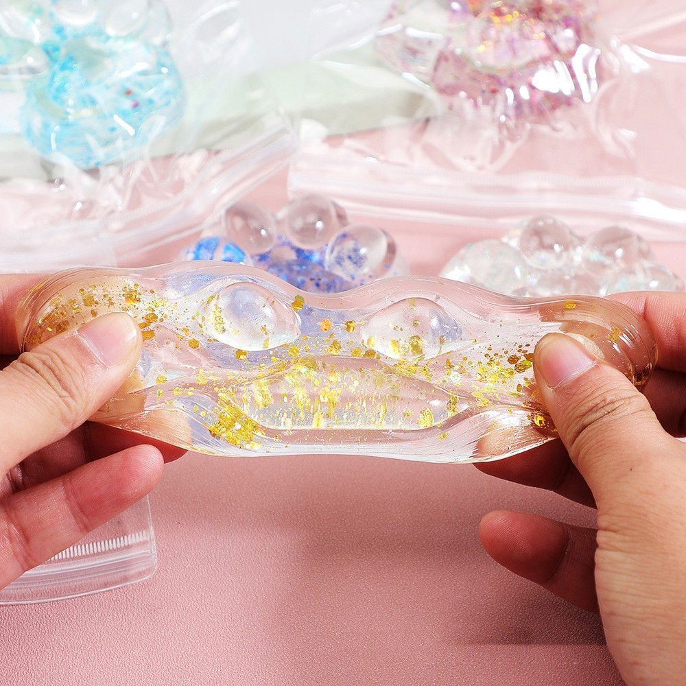 Jucarie Antistres Squishy, Flippy, cu Revenire Lenta, Squeeze Pinch Family, Model Cat Paw, 6.5 x 7 cm, din Tpr, 4-6 Ani, Model 4 Sclipici, Transparent [9]