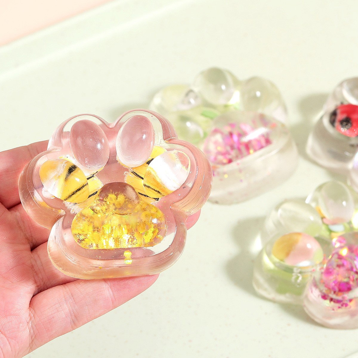 Jucarie Antistres Squishy, Flippy, cu Revenire Lenta, Squeeze Pinch Family, Model Cat Paw, 6.5 x 7 cm, din Tpr, 4-6 Ani, Model 7 Insecte, Transparent [9]